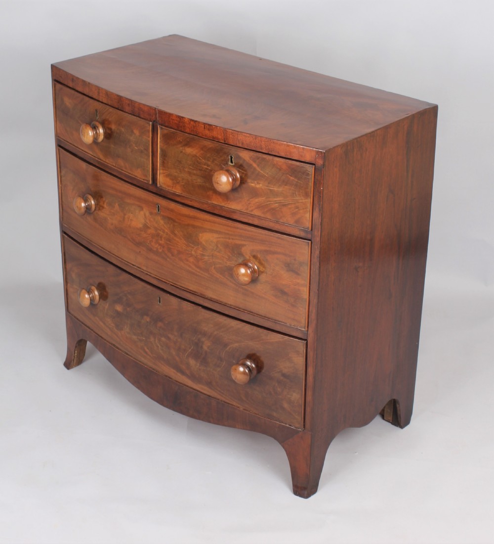 A small early Victorian bow-fronted mahogany chest of drawers View III