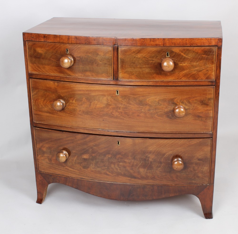 A small early Victorian bow-fronted mahogany chest of drawers View IV