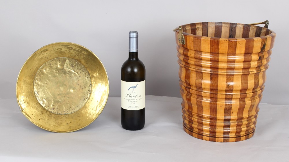An early nineteenth-century Dutch teestoof bucket featuring alternating light and dark wooden staves, ribbed horizontal shaping, and a brass swing handle. View II
