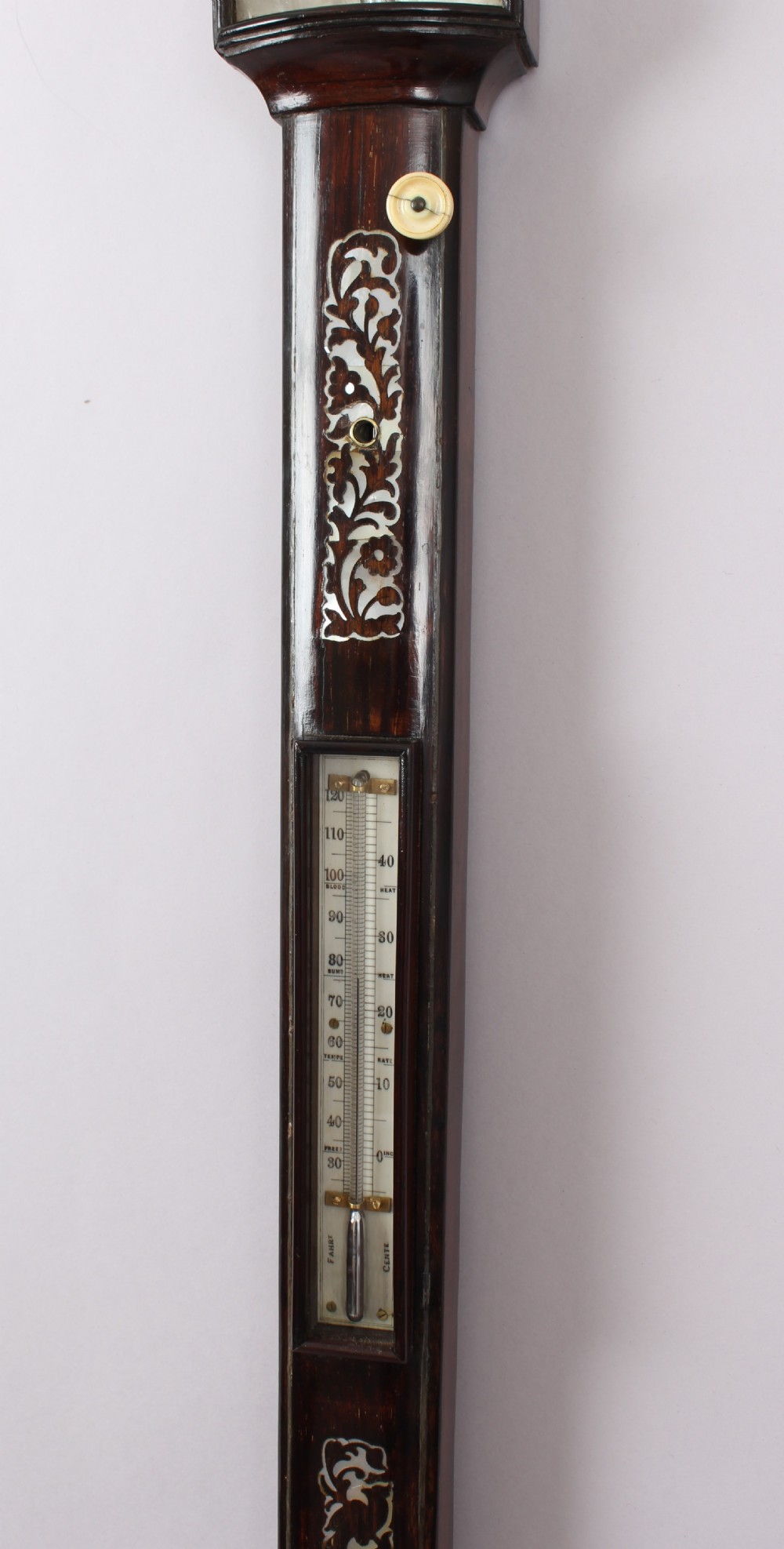 A bow-fronted marine barometer in a well-figured rosewood case View III
