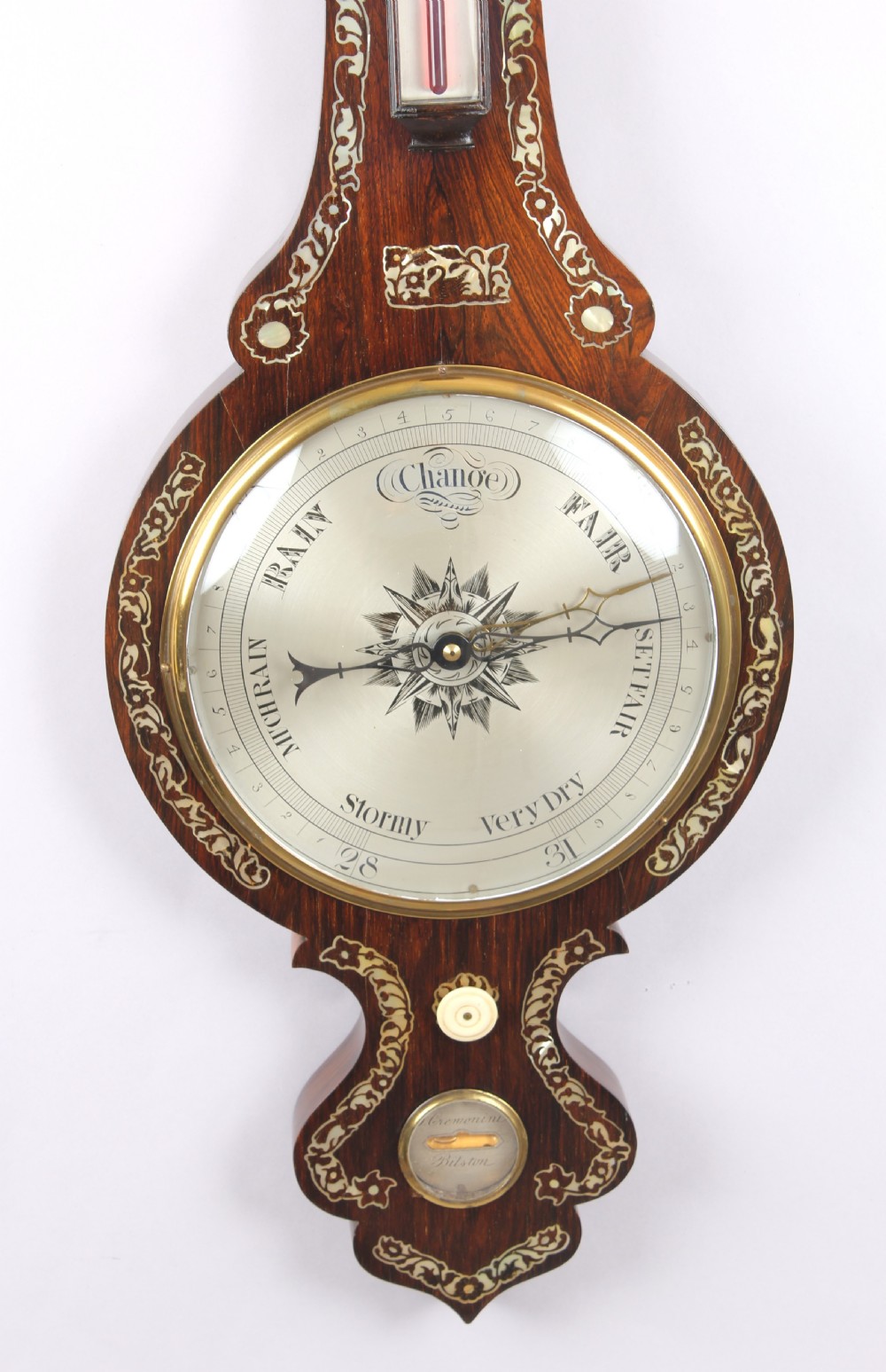 A Victorian rosewood banjo wheel barometer decorated with mother-of-pearl floral inlays, featuring a central thermometer and silvered weather dial. View III
