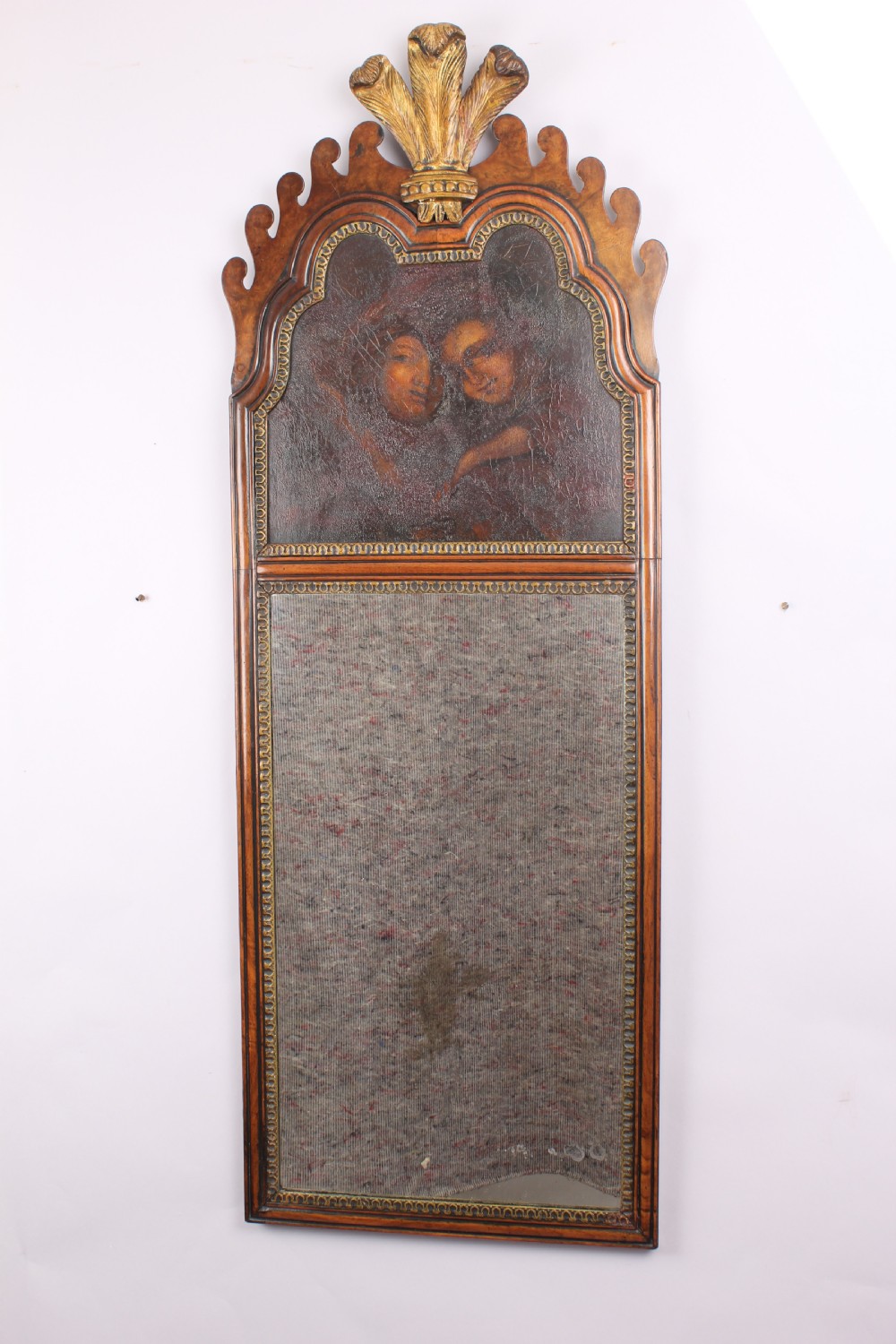 Decorative walnut and gilt mirror with a painted panel 