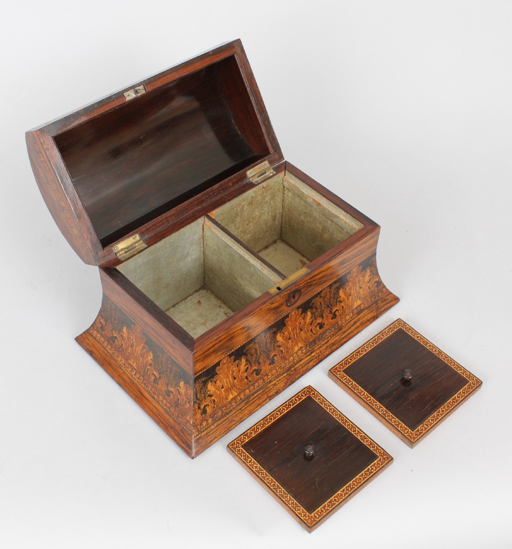 A nineteenth-century domed rosewood tea caddy with elaborate geometric inlaid borders and a central landscape transfer image on the lid. View V