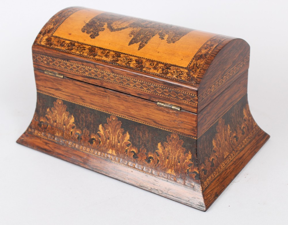 A nineteenth-century domed rosewood tea caddy with elaborate geometric inlaid borders and a central landscape transfer image on the lid. View VI