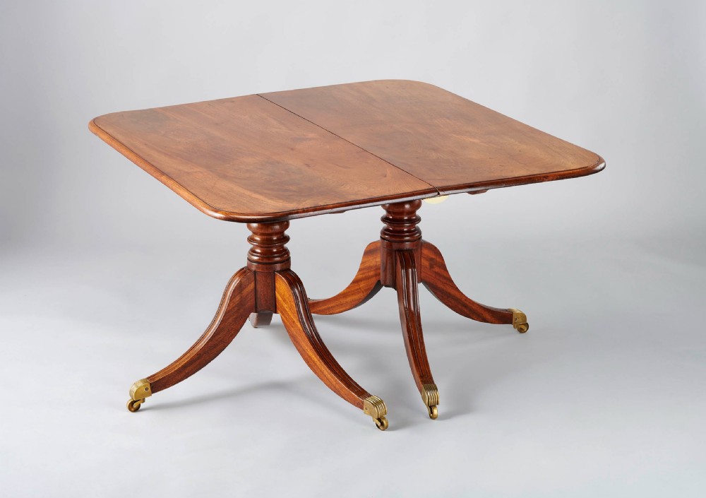 George IV period mahogany twin-pedestal dining-table of good mellow colour View III