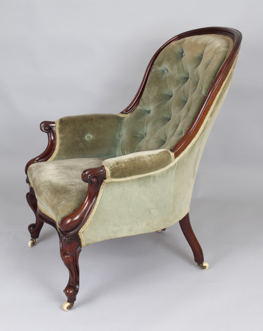 A pair of mid-Victorian comfortable easy chairs View II