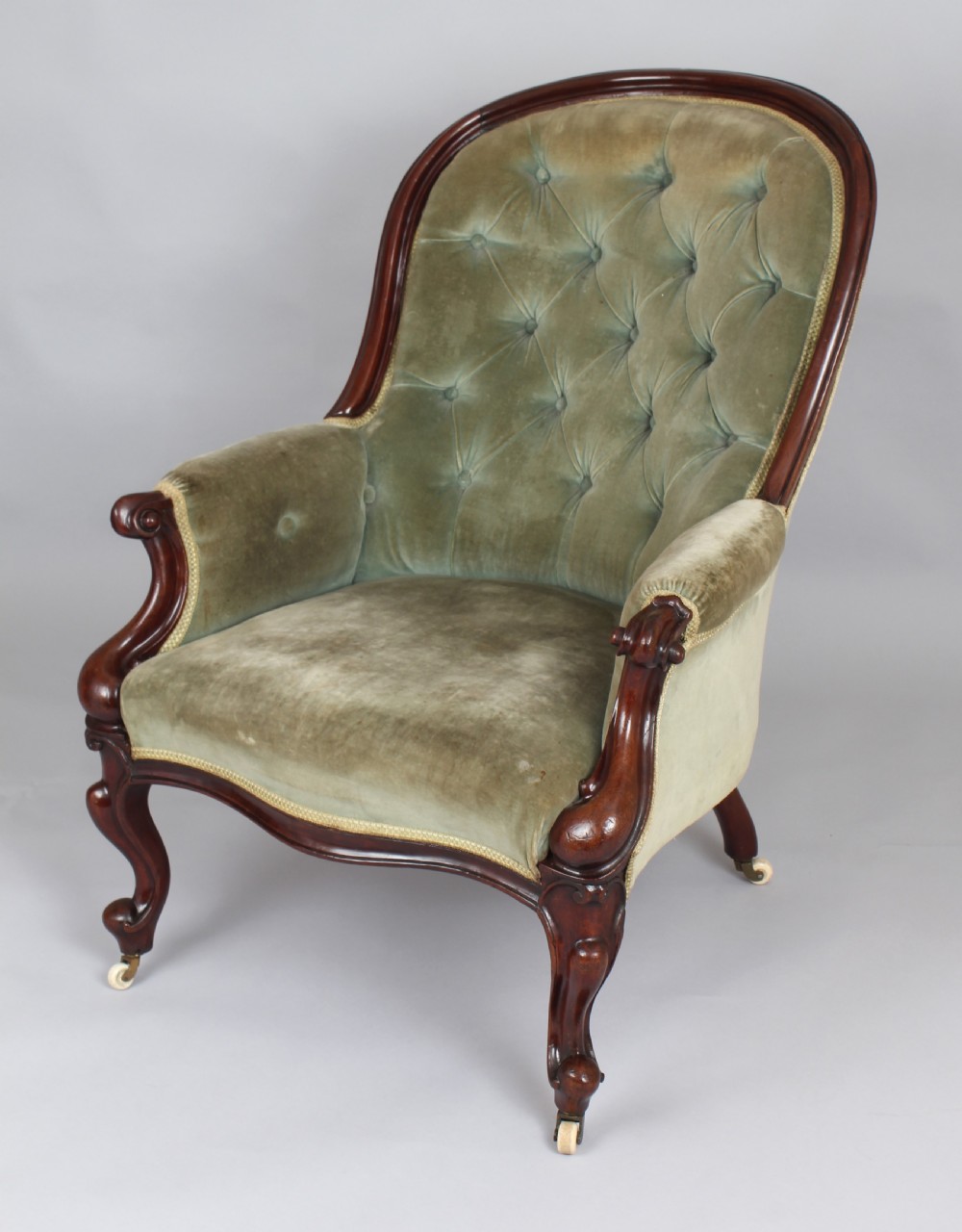 A pair of mid-Victorian comfortable easy chairs View V