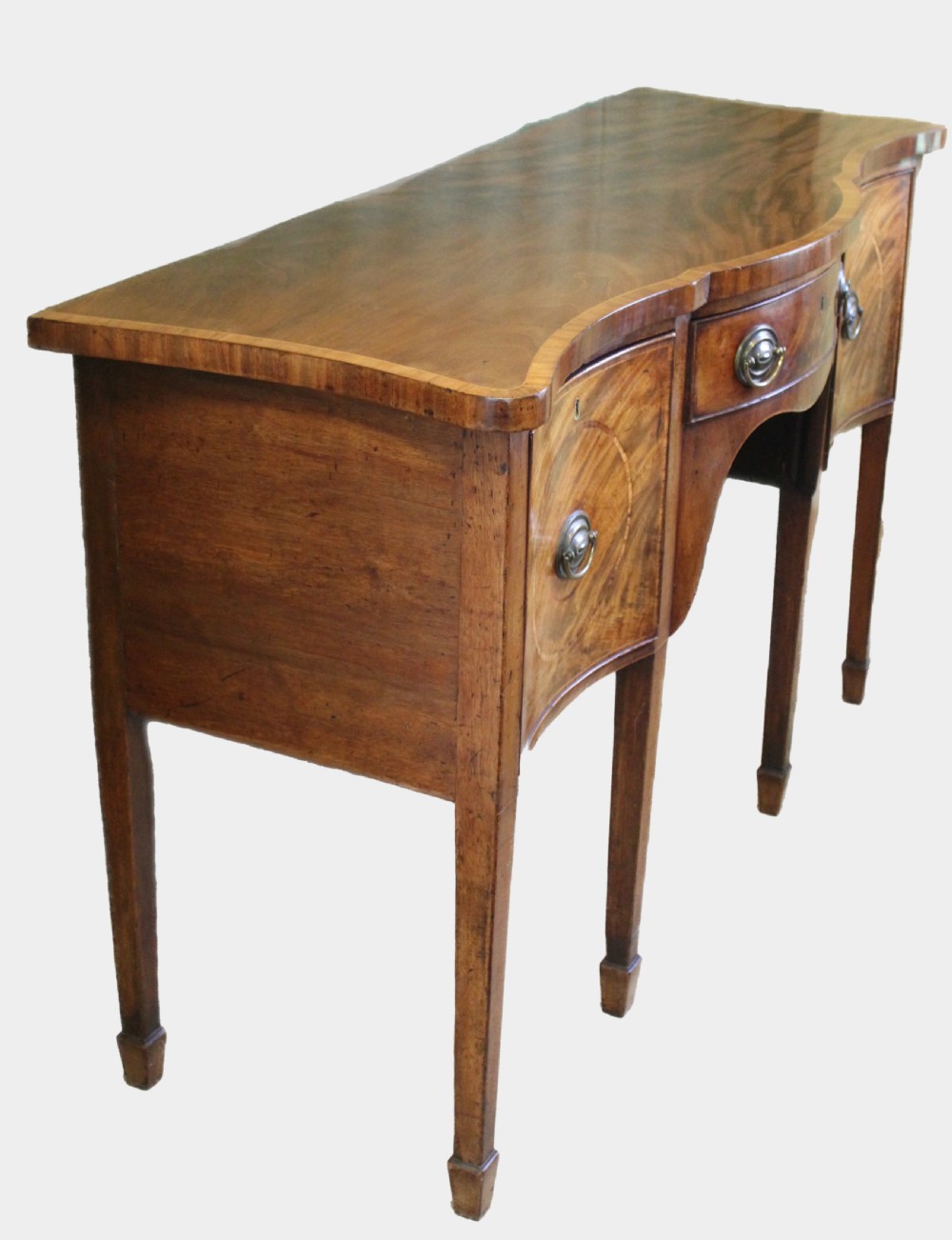 A Hepplewhite period mahogany serpentine fronted sideboard of delightfully small proportions View III