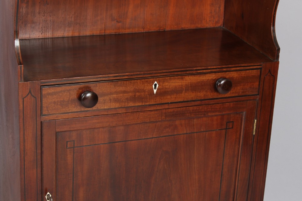 George III period mahogany cupboard base water fall bookshelves  View IV