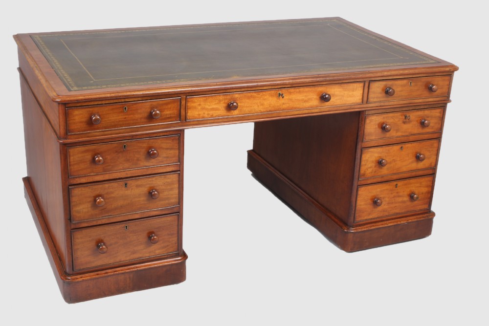 A William IV mahogany three part free standing pedestal desk