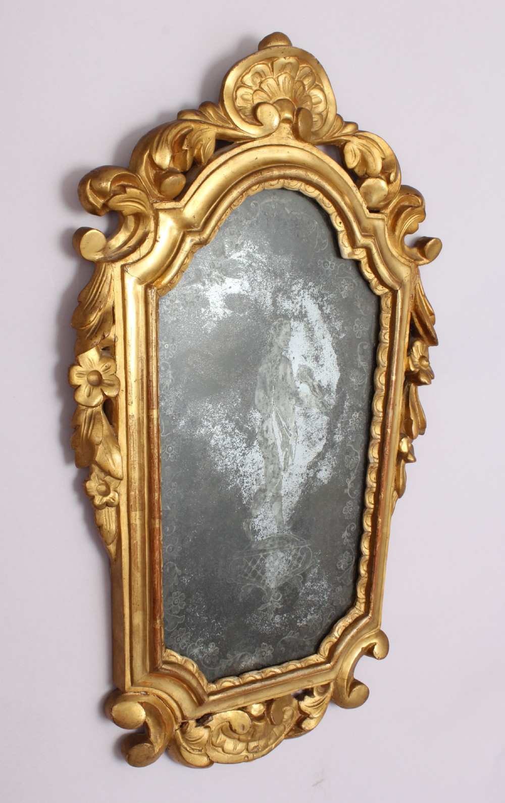 Carved and giltwood mirror in the Rococo taste