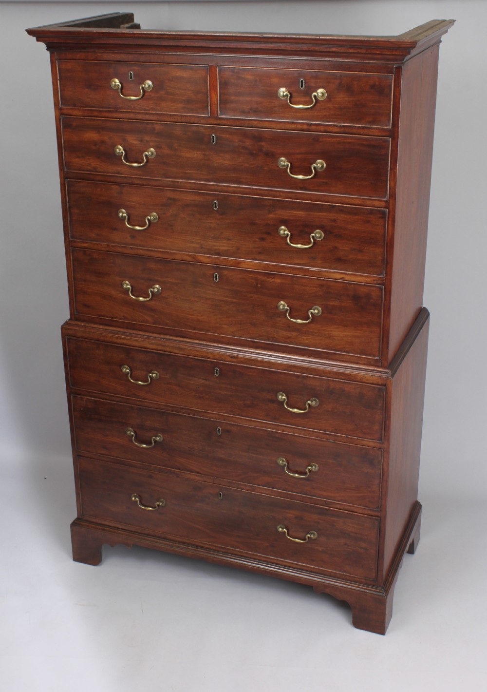Fine quality figured plum pudding mahogany chest on chest tallboy of especially small size a