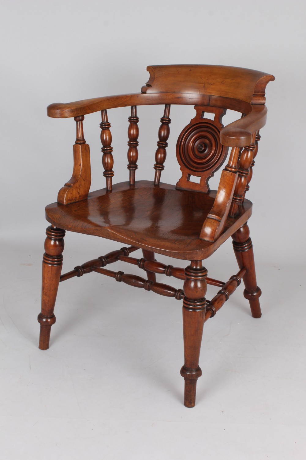 A pair of 19th-century satin birch smokers bow armchairs featuring turned spindles, central carved roundel splats, and shaped wooden seats. View IV