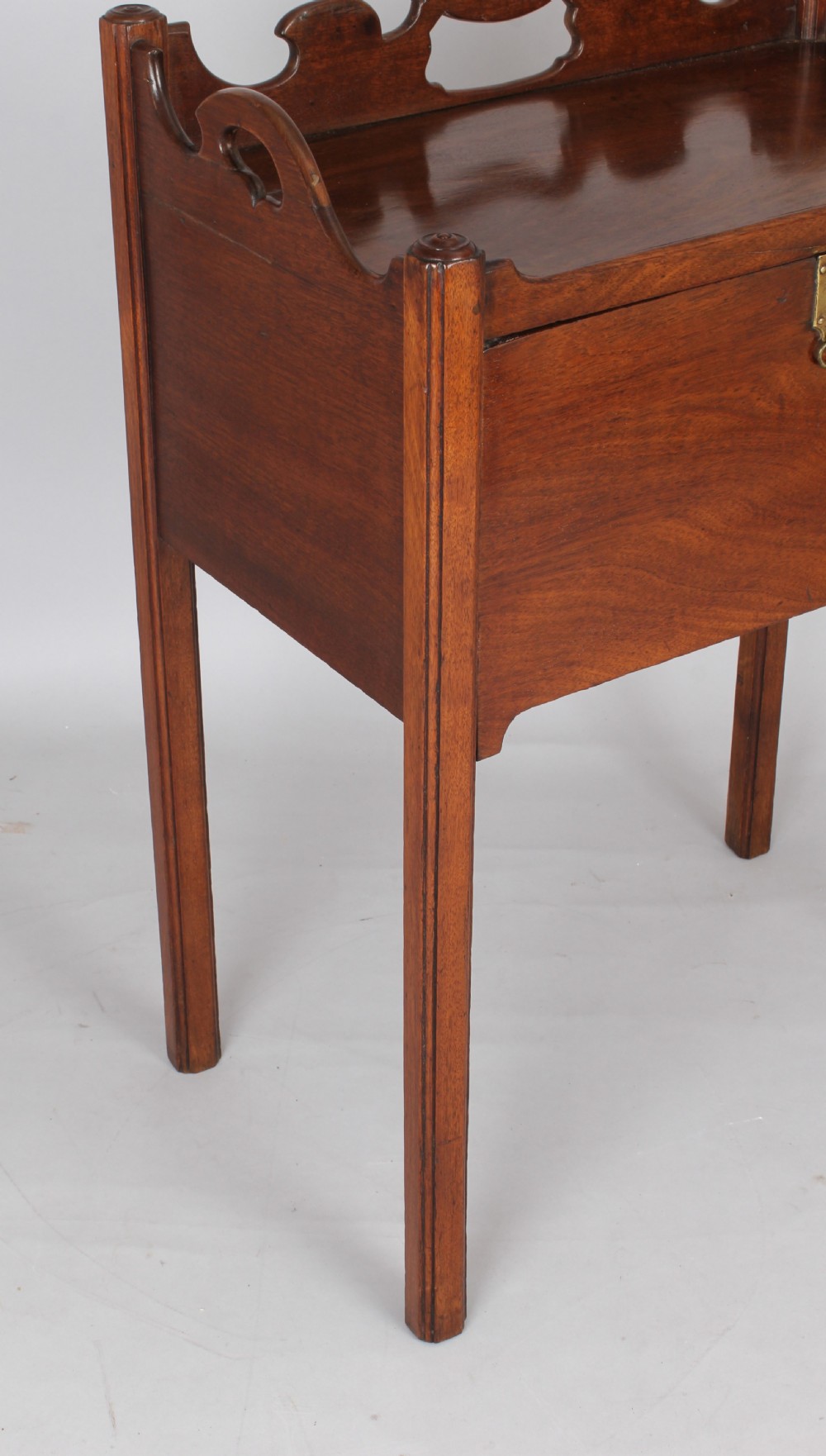 An unusual George III period mahogany night table View IV