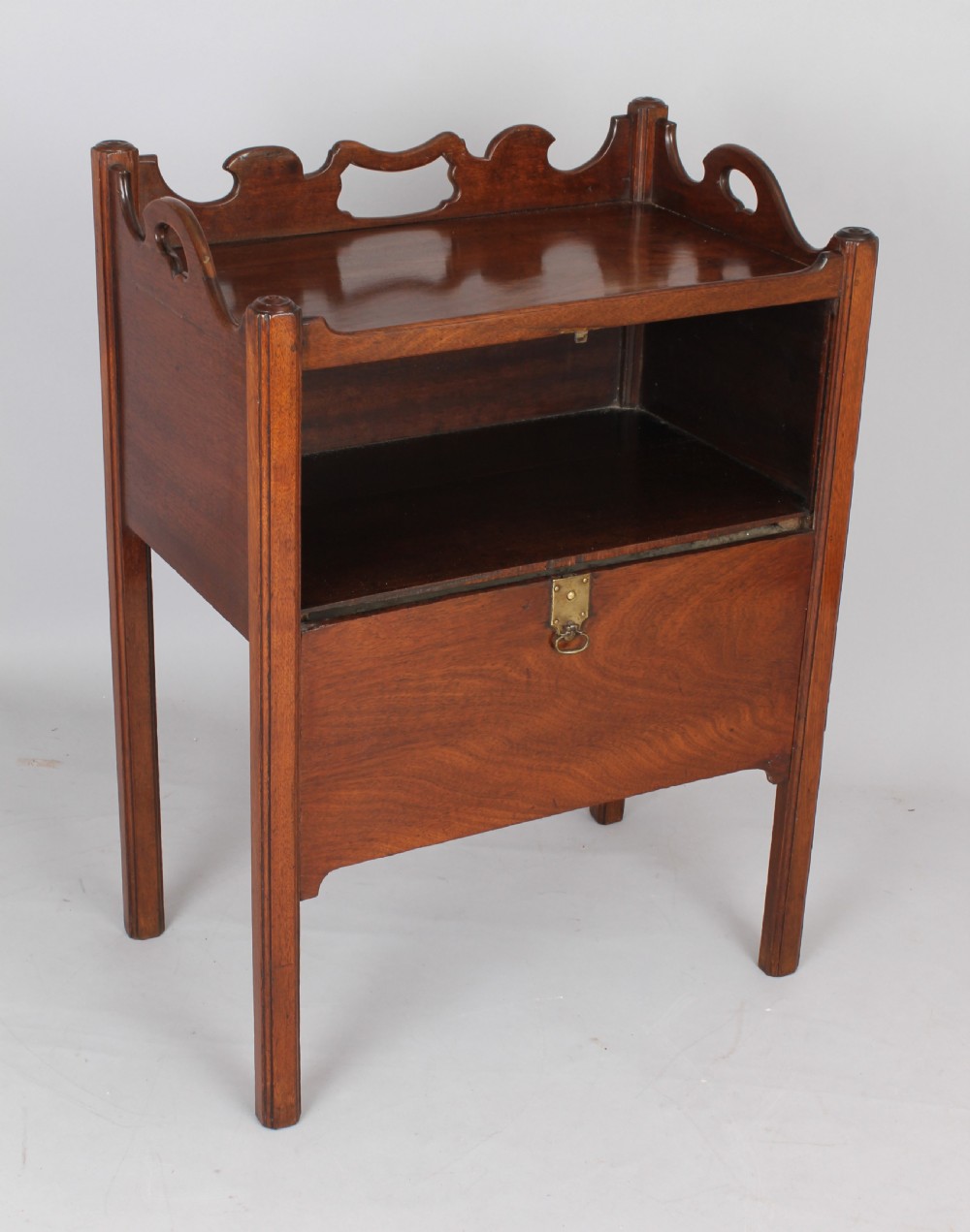 An unusual George III period mahogany night table View V