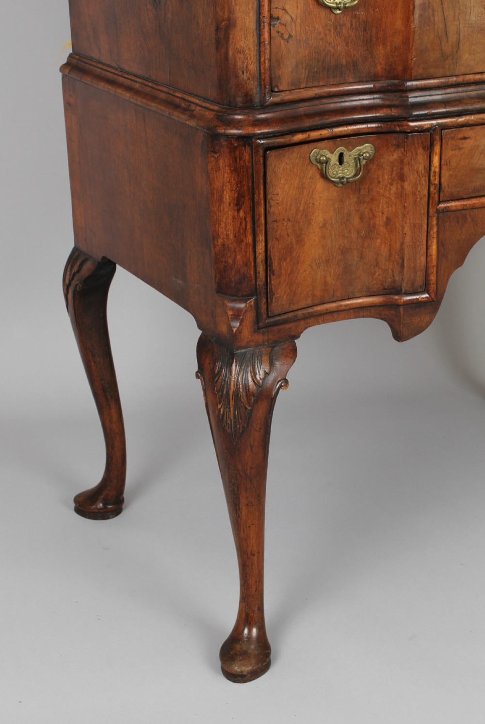 Queen Anne revival walnut chest on stand with a shaped front View III