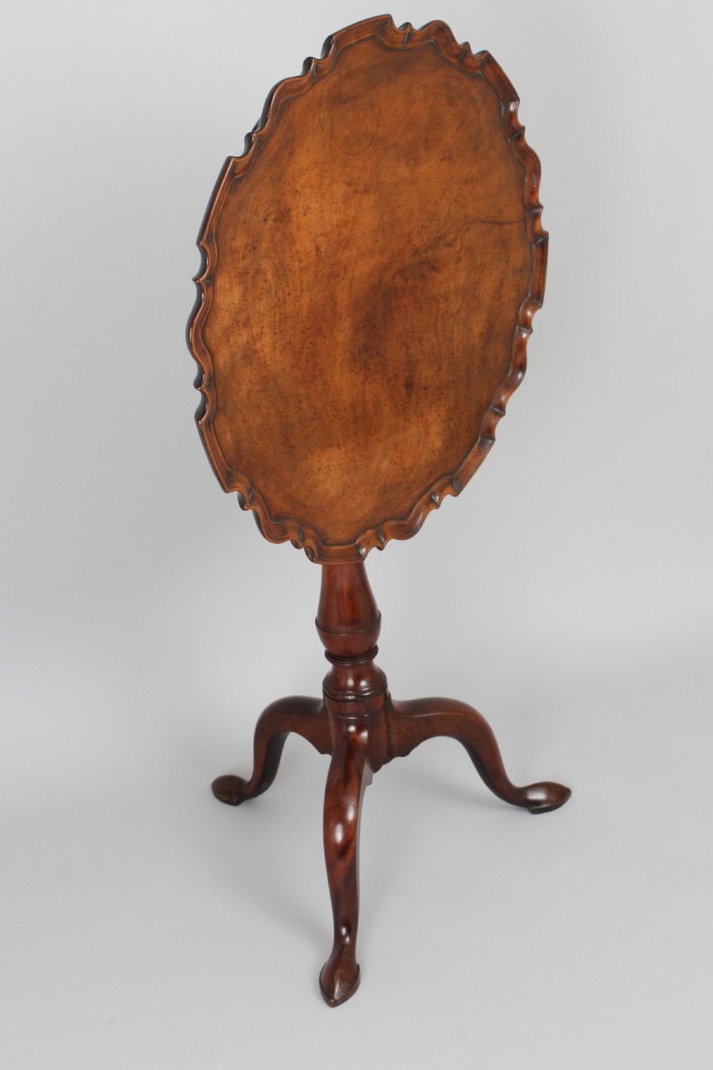 A George III period mahogany tripod table View II