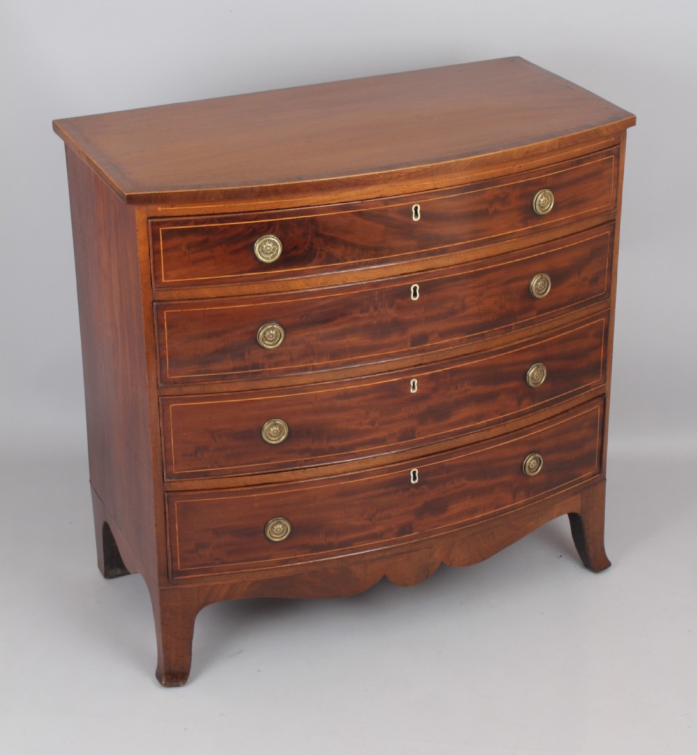 Mahogany bow-fronted chest of four graduated drawers