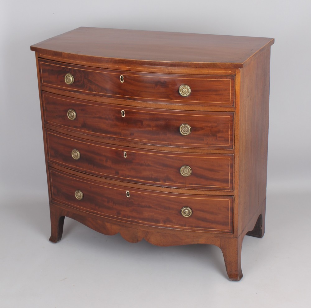 Mahogany bow-fronted chest of four graduated drawers View II