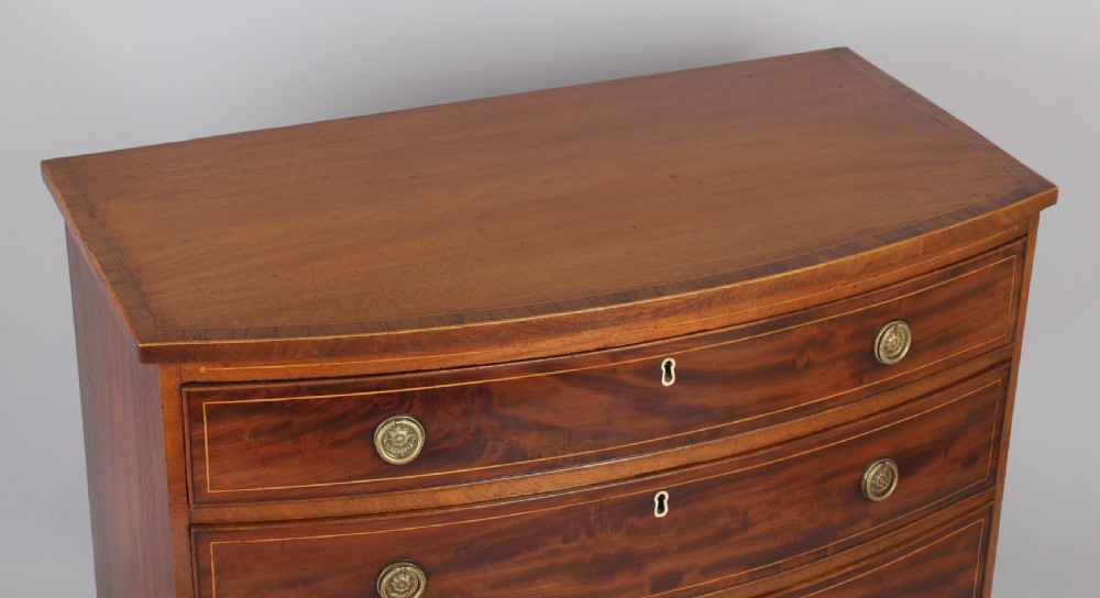 Mahogany bow-fronted chest of four graduated drawers View IV