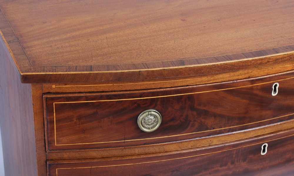 Mahogany bow-fronted chest of four graduated drawers View V