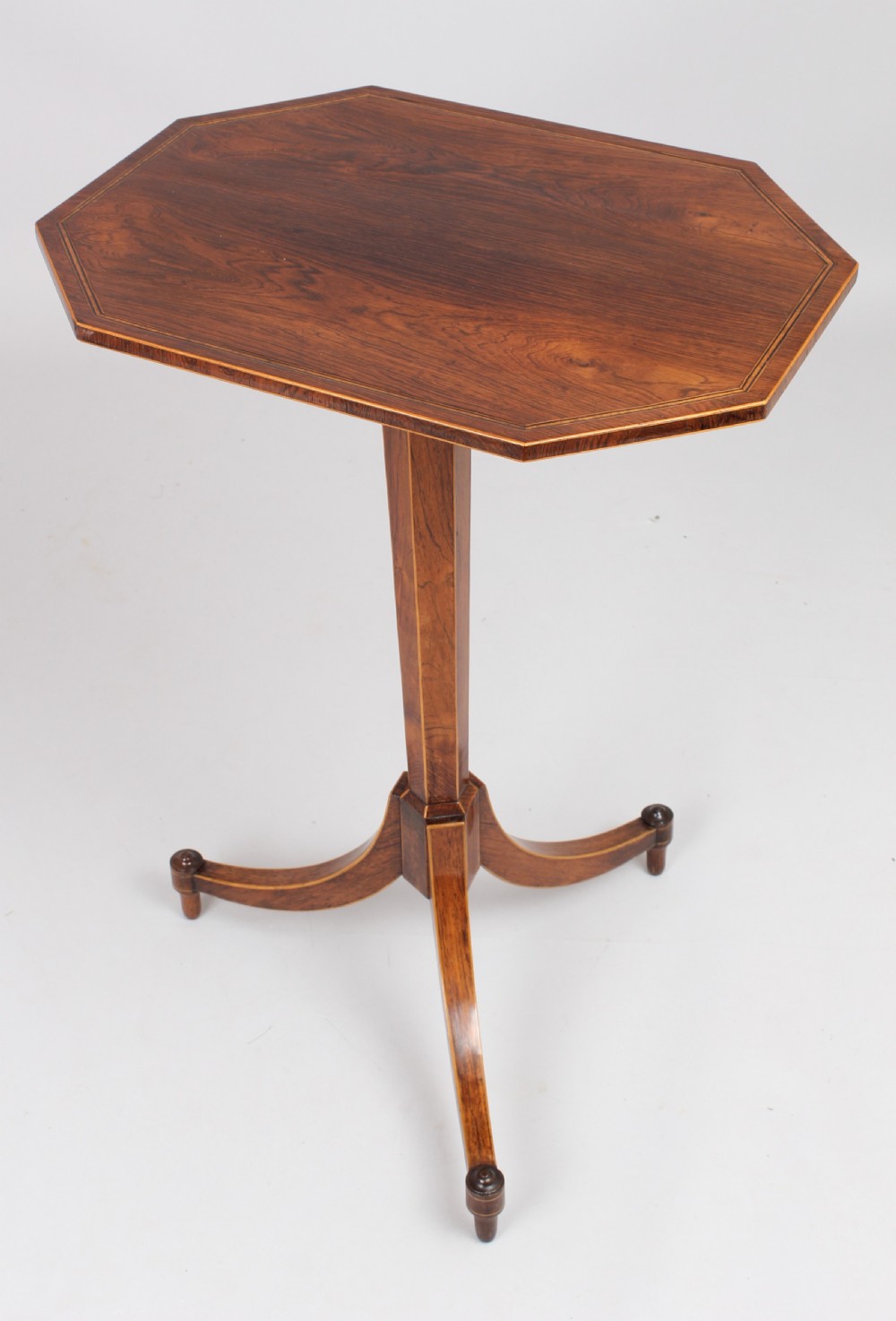 An early 19th century rosewood tripod table