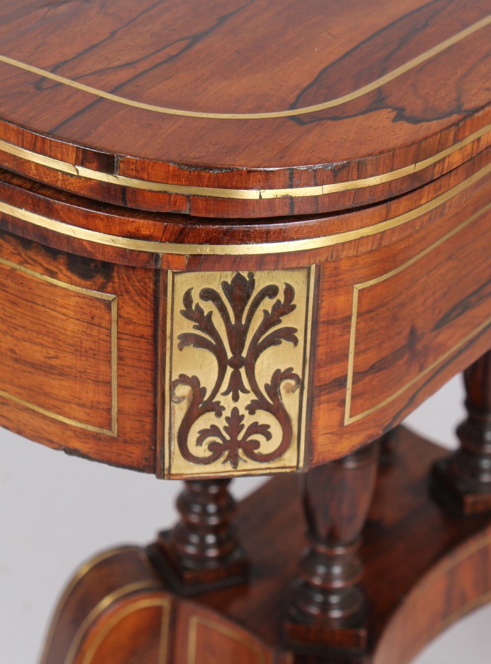 Regency rosewood D-shaped games table with a revolving top View IV