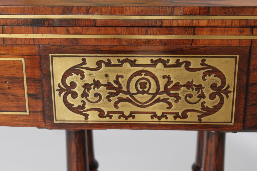 Regency rosewood D-shaped games table with a revolving top View V