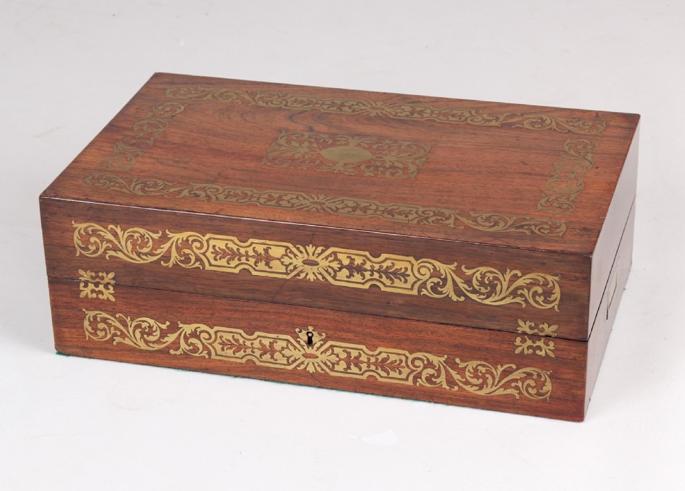 An open early Victorian rosewood games compendium featuring small wooden drawers, a green velvet playing surface, and a red gilt-tooled backgammon interior section. View II