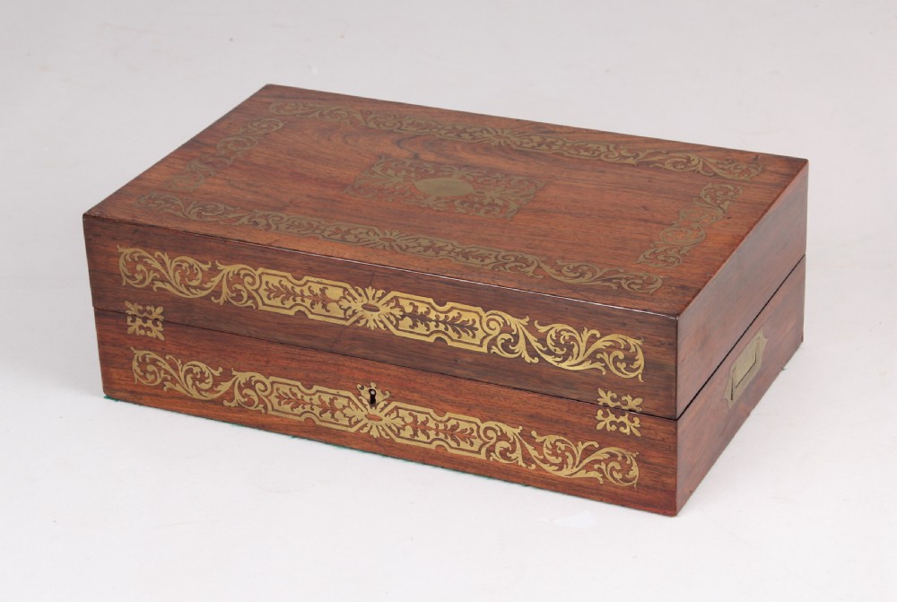 An open early Victorian rosewood games compendium featuring small wooden drawers, a green velvet playing surface, and a red gilt-tooled backgammon interior section. View III