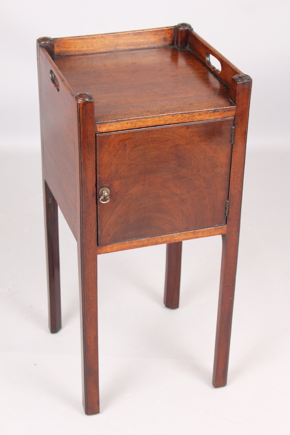 A George III mahogany pot cupboard or bed side table