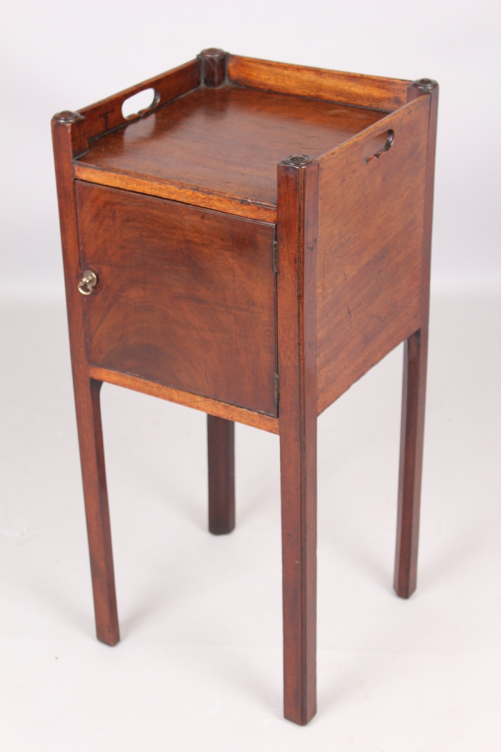 A George III mahogany pot cupboard or bed side table View II