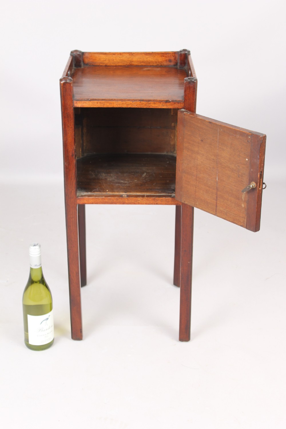 A George III mahogany pot cupboard or bed side table View III