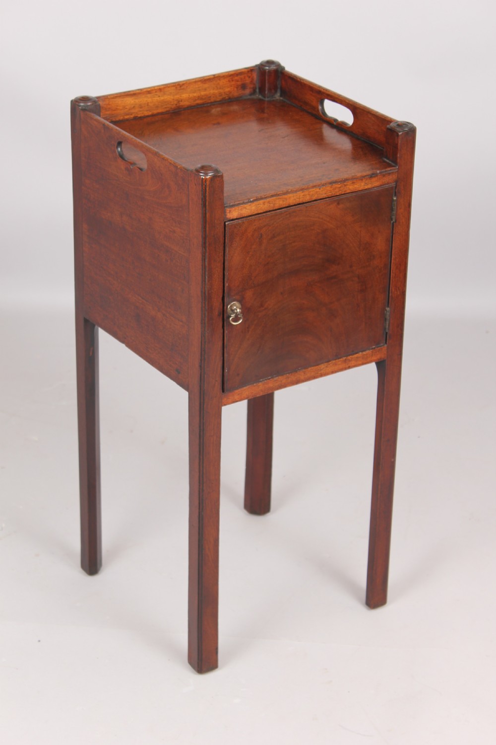 A George III mahogany pot cupboard or bed side table View IV