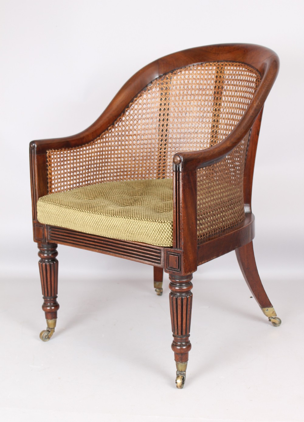 An early 19th century mahogany bergere View II
