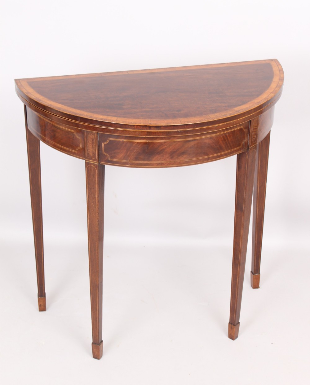 Mahogany half round card table of rare small size