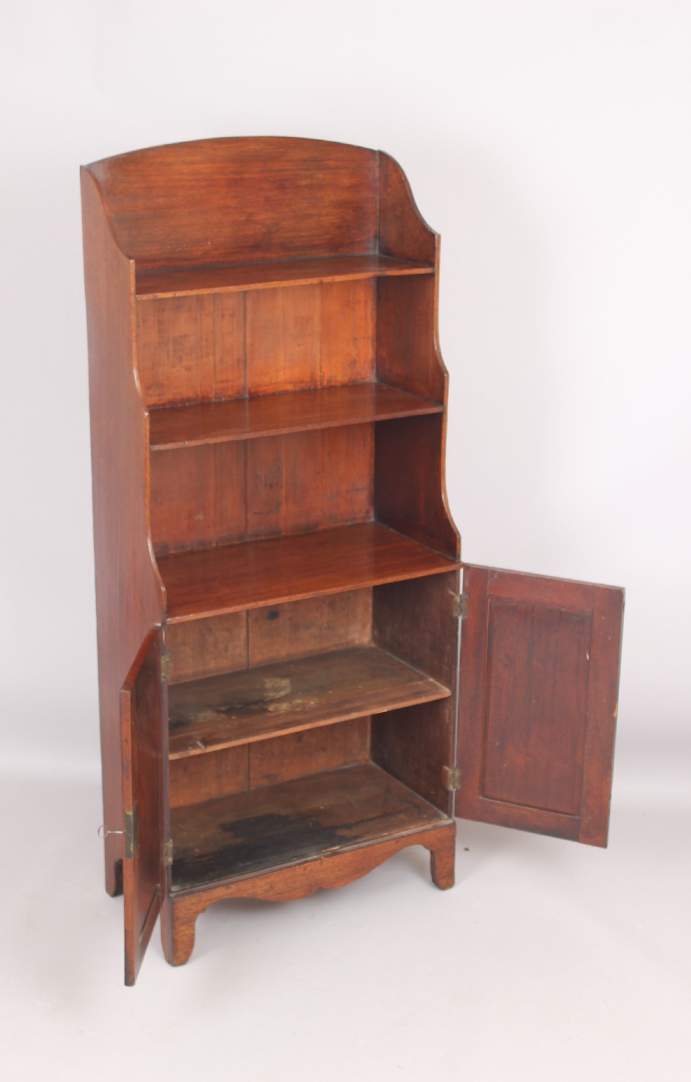 Small mahogany cupboard based waterfall open bookshelves View II