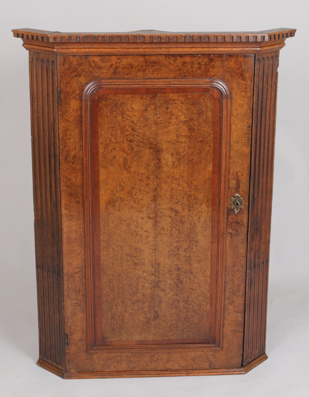 Early George III period burr oak corner cupboard