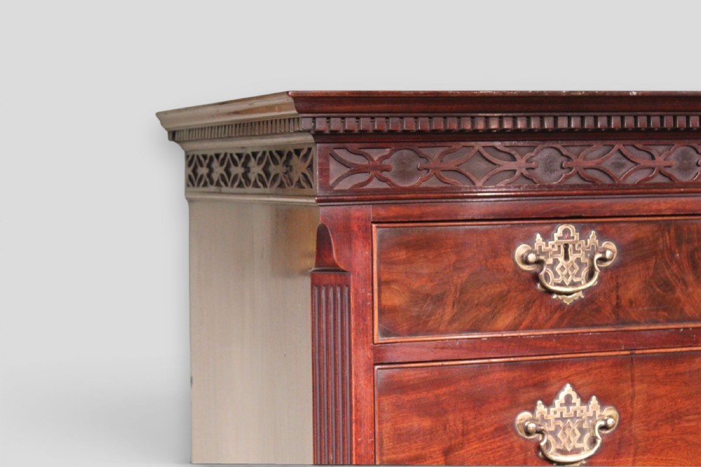 An eighteenth-century mahogany tallboy chest-on-chest featuring a carved frieze, brass swan-neck handles, and bracket feet. View II