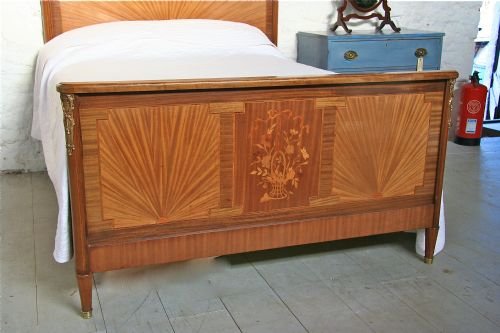 fig 1. French walnut king size bedstead with marquetry and ormalu detail