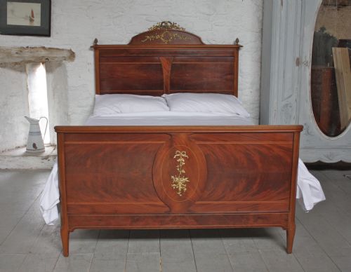 fig 1. French Empire style walnut and mahogany king size bed with ormalu