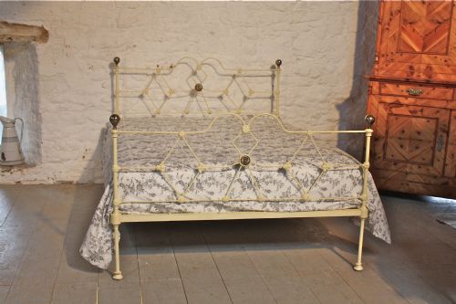fig 1. Early Victorian double  aged cream iron low height bed