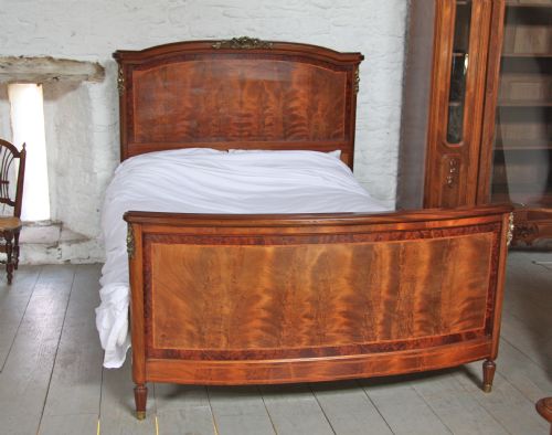 fig 1. French Walnut and mahogany king size bed with bronze rose mounts (matching armoire available)