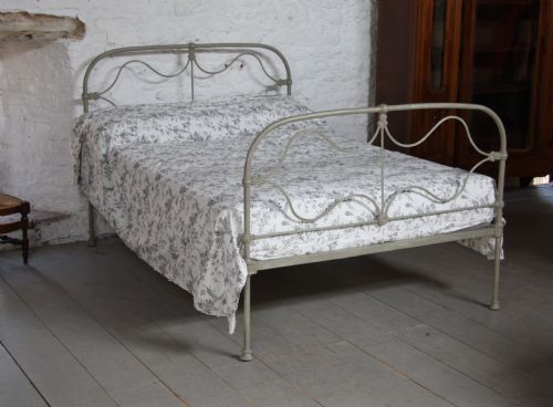 fig 1. Early all iron Irish bed in aged vintage retro paint colour