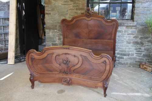 fig 1. Rosewood Louis XV style French king size bed with carved detail
