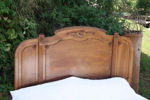 fig 1. Unusual attractive French walnut kingsize bed with carved detail c1900
