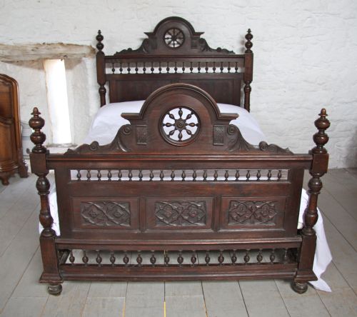fig 1. Carved French Bretton dark oak bed with bedside