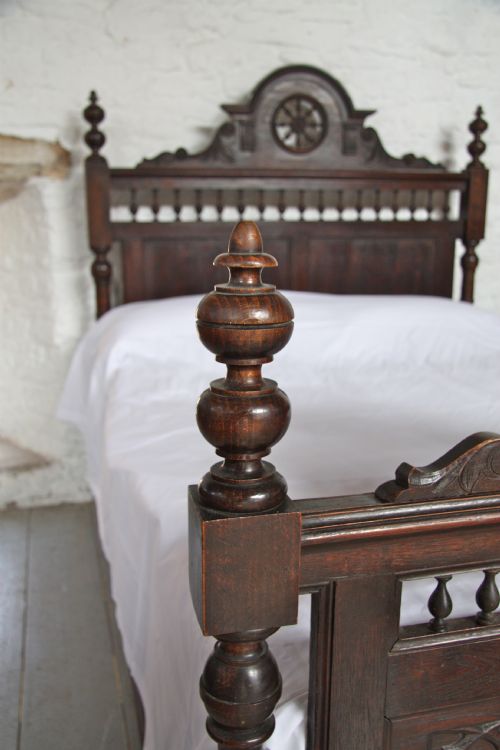 fig 2. Carved French Bretton dark oak bed with bedside