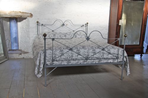 fig 1. Pretty English iron king size bed with brass knobs in mid lead grey