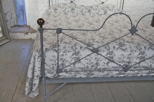 fig 2. Pretty English iron king size bed with brass knobs in mid lead grey